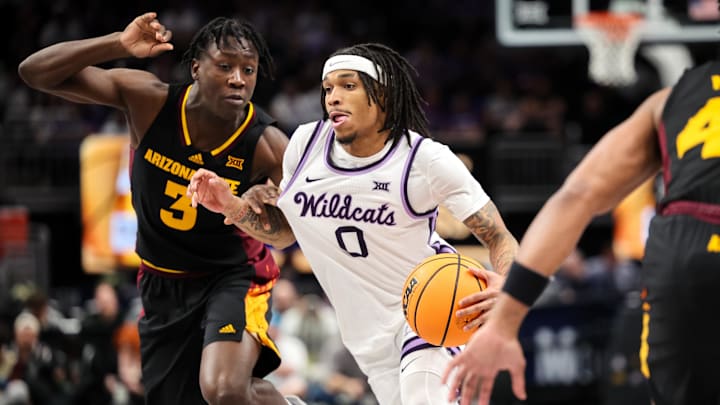 Mar 11, 2025; Kansas City, MO, USA; Kansas State Wildcats guard Dug McDaniel (0) drives to the basket around Arizona State Sun Devils guard Joson Sanon (3) during the first half at T-Mobile Center. Mandatory Credit: William Purnell-Imagn Images