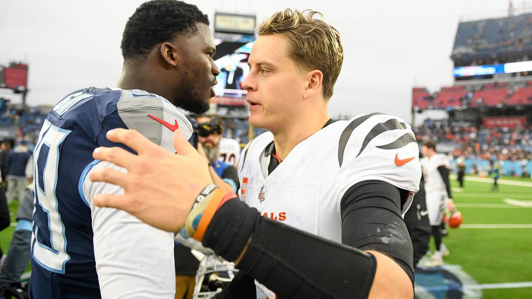 Dec 15, 2024; Nashville, Tennessee, USA; Cincinnati Bengals quarterback Joe Burrow (9) and Tennessee Titans defensive tackle Jeffery Simmons (98) during the second half at Nissan Stadium. Mandatory Credit: Steve Roberts-Imagn Images Dec 15, 2024; Nashville, Tennessee, USA; Cincinnati Bengals quarterback Joe Burrow (9) and Tennessee Titans defensive tackle Jeffery Simmons (98) during the second half at Nissan Stadium. Mandatory Credit: Steve Roberts-Imagn Images