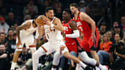 Nov 24, 2025; Phoenix, Arizona, USA; Phoenix Suns guard Devin Booker (1) against Houston Rockets guard Aaron Holiday (0) in the first half at Mortgage Matchup Center. Mandatory Credit: Mark J. Rebilas-Imagn Images