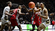 Purdue forward Trey Kaufman-Renn loses control of the ball in front of Ohio State forward Aaron Bradshaw