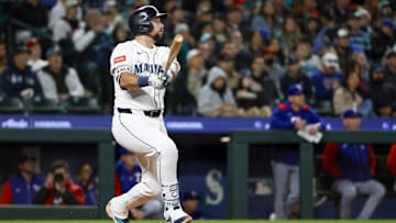 Apr 12, 2025; Seattle, Washington, USA; Seattle Mariners catcher Cal Raleigh (29) hits a solo-home run against the Texas Rangers during the fifth inning at T-Mobile Park. Mandatory Credit: Joe Nicholson-Imagn Images