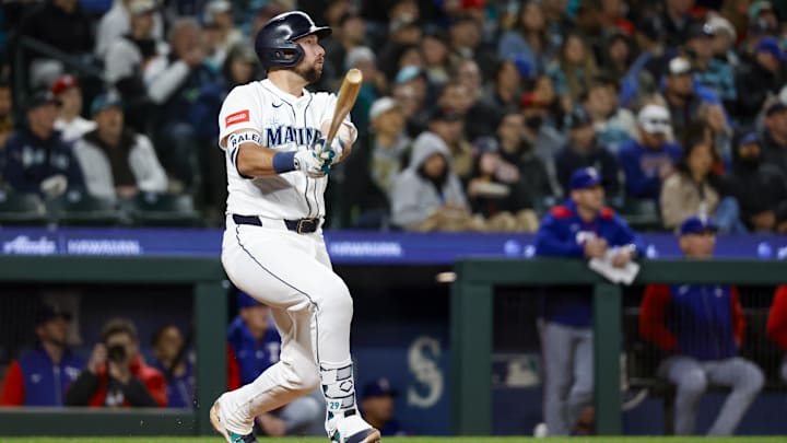 Apr 12, 2025; Seattle, Washington, USA; Seattle Mariners catcher Cal Raleigh (29) hits a solo-home run against the Texas Rangers during the fifth inning at T-Mobile Park. Mandatory Credit: Joe Nicholson-Imagn Images