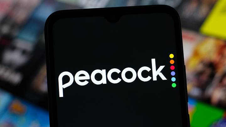 In this photo illustration, the Peacock logo is seen...