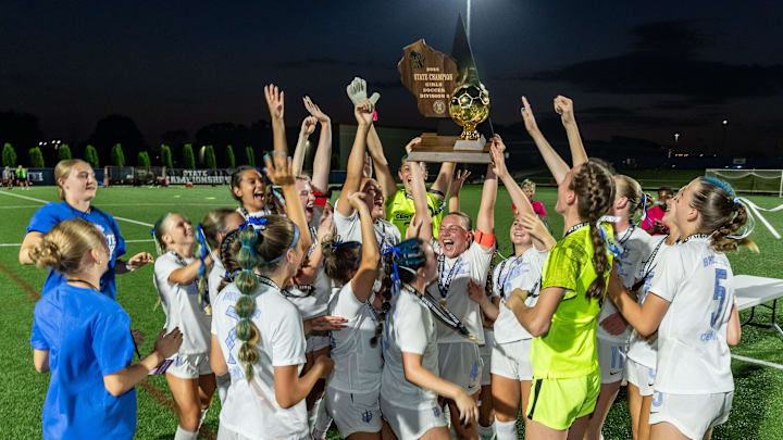 Brookfield Central players celebrate with the gold trophy ball after winning the WIAA Division 2 girls state soccer championship, 2-1, over Pewaukee on Saturday, June 21, 2025 at Uihlein Soccer Park in Milwaukee, Wisconsin.