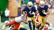 Notre Dame running back Jeremiyah Love (4) runs with the ball on his way to score a touchdown in the first half of a NCAA football game against Syracuse at Notre Dame Stadium on Saturday, Nov. 22, 2025, in South Bend.