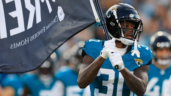 Jacksonville Jaguars cornerback Montaric Brown (30) carries a Jaguars flag onto the field before a preseason NFL football game Saturday, Aug. 17, 2024 at EverBank Stadium in Jacksonville, Fla. The Jacksonville Jaguars defeated the Tampa Bay Buccaneers 20-7. [Corey Perrine/Florida Times-Union]