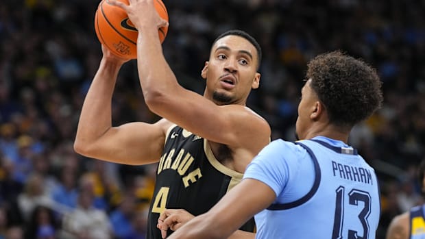 Purdue Boilermakers forward Trey Kaufman-Renn (4) looks to pass 