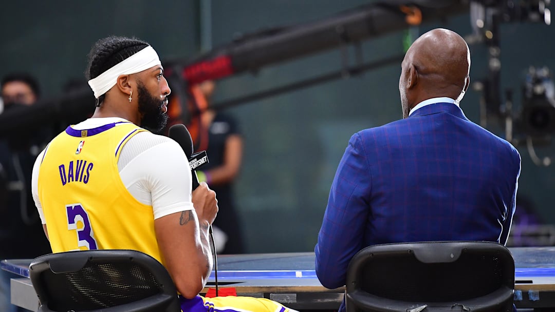 Sep 26, 2022; El Segundo, CA, USA; Los Angeles Lakers forward Anthony Davis (3) is interviewed by Spectrum Sportsnet analyst James Worthy during Lakers Media Day at UCLA Health Training Center. Mandatory Credit: Gary A. Vasquez-Imagn Images