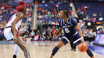 Mar 7, 2025; Greensboro, NC, USA;  Georgia Tech Yellow Jackets guard Tonie Morgan (5) sets the play during the second quarter against NC State Wolfpack at First Horizon Coliseum. Mandatory Credit: Cory Knowlton-Imagn Images