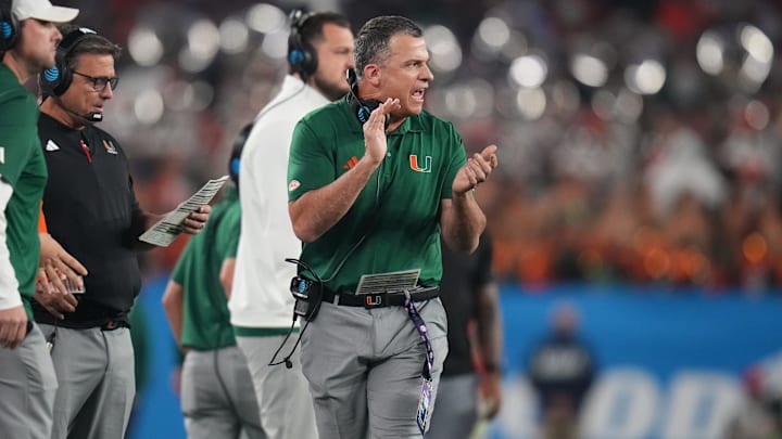 Miami Hurricanes head coach Mario Cristobal walks the sideline as his team plays the Ole Miss Rebels during their Vrbo Fiesta Bowl matchup at State Farm Stadium in Glendale, on Jan. 8, 2026.
