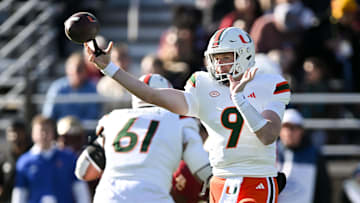 Nov 24, 2023; Chestnut Hill, Massachusetts, USA; Miami Hurricanes quarterback Tyler Van Dyke (9) throws against the Boston College Eagles during the first half at Alumni Stadium. Mandatory Credit: Brian Fluharty-Imagn Images