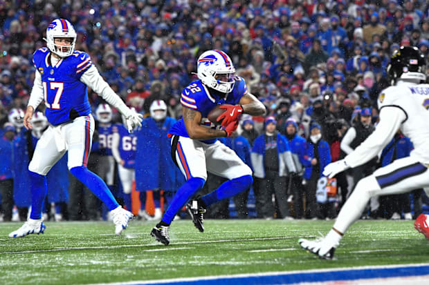 Buffalo Bills running back, Ray Davis carries the ball against the Baltimore Ravens.