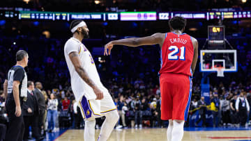 Dec 9, 2022; Philadelphia, Pennsylvania, USA; Philadelphia 76ers center Joel Embiid (21) jokingly pushes Los Angeles Lakers forward Anthony Davis (3) as time winds down on an overtime 76ers victory at Wells Fargo Center. Mandatory Credit: Bill Streicher-USA TODAY Sports