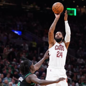 May 15, 2024; Boston, Massachusetts, USA; Cleveland Cavaliers forward Marcus Morris Sr. (24) shoots against Boston Celtics guard Jrue Holiday (4) in the second quarter during game five of the second round for the 2024 NBA Playoffs at TD Garden.