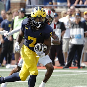 Sep 14, 2024; Ann Arbor, Michigan, USA;  Michigan Wolverines running back Donovan Edwards (7) runs for a touchdown first half against the Arkansas State Red Wolves at Michigan Stadium. Mandatory Credit: Rick Osentoski-Imagn Images