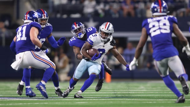 Dallas Cowboys wide receiver Brandin Cooks (3) is tackled by New York Giants safety Jason Pinnock (27)