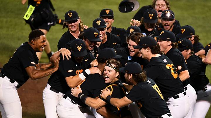 Tennessee's Cal Stark (10) and Tennessee's Marcus Phillips (44) and the center of the dogpile as the teams celebrates their win over Evansville in the Knoxville Super Regional of the NCAA baseball tournament on Sunday, June 9, 2024 in Knoxville, Tenn.