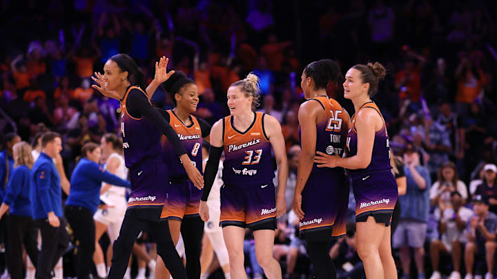 Jul 9, 2025; Phoenix, Arizona, USA; Phoenix Mercury forward Alyssa Thomas (25) celebrates with teammates Kathryn Westbeld (24), Sami Whitcomb (33), Monique Akoa Makani (8) and DeWanna Bonner (24) against the Minnesota Lynx during the second half at PHX Arena. Mandatory Credit: Mark J. Rebilas-Imagn Images