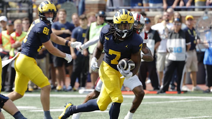 Sep 14, 2024; Ann Arbor, Michigan, USA;  Michigan Wolverines running back Donovan Edwards (7) runs for a touchdown first half against the Arkansas State Red Wolves at Michigan Stadium. Mandatory Credit: Rick Osentoski-Imagn Images