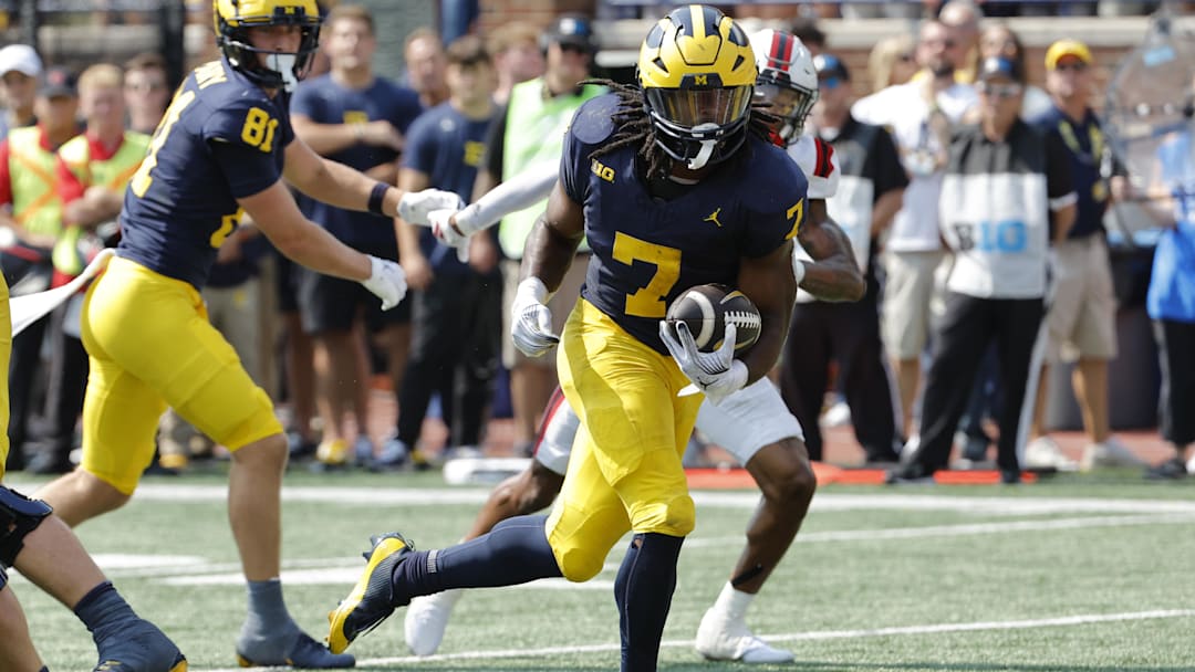 Sep 14, 2024; Ann Arbor, Michigan, USA;  Michigan Wolverines running back Donovan Edwards (7) runs for a touchdown first half against the Arkansas State Red Wolves at Michigan Stadium. Mandatory Credit: Rick Osentoski-Imagn Images