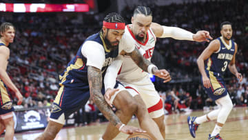 Jan 31, 2024; Houston, Texas, USA; New Orleans Pelicans forward Brandon Ingram (14) attempts to get a loose ball away from Houston Rockets forward Dillon Brooks (9) during the third quarter at Toyota Center. Mandatory Credit: Troy Taormina-USA TODAY Sports