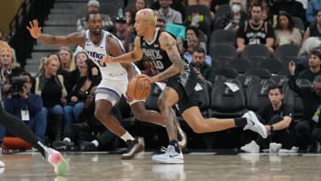 Jan 15, 2023; San Antonio, Texas, USA;  San Antonio Spurs forward Jeremy Sochan (10) dribbles against Sacramento Kings forward Harrison Barnes (40) in the second half at the AT&T Center. Mandatory Credit: Daniel Dunn-USA TODAY Sports