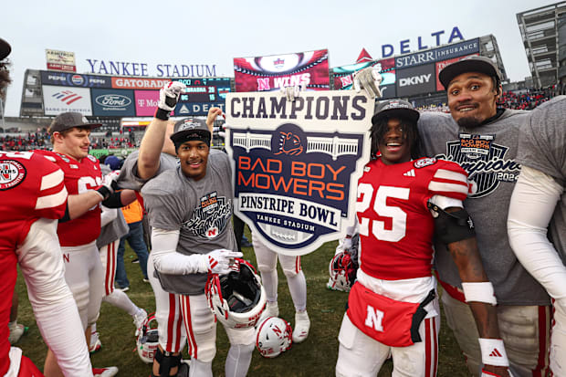 Nebraska Cornhuskers running back Kenneth Williams (25) celebrates with teammates after the 2025 Pinstripe Bow.