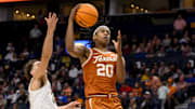 Mar 12, 2025; Nashville, TN, USA;  Texas Longhorns guard Tre Johnson (20) lays the ball in against the Vanderbilt Commodores during the second half at Bridgestone Arena. Mandatory Credit: Steve Roberts-Imagn Images