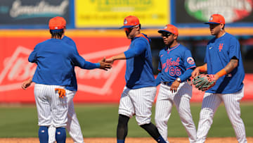 Feb 17, 2025; Port St. Lucie, FL, USA; New York Mets right fielder Juan Soto (22) celebrates with shortstop Francisco Lindor (12) during a spring training workout at Clover Park. Mandatory Credit: Sam Navarro-Imagn Images