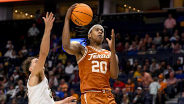 Mar 12, 2025; Nashville, TN, USA;  Texas Longhorns guard Tre Johnson (20) lays the ball in against the Vanderbilt Commodores during the second half at Bridgestone Arena.