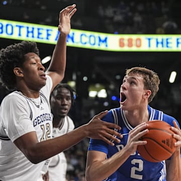 Dec 21, 2024; Atlanta, Georgia, USA; Duke Blue Devils guard Cooper Flagg (2) is defended by Georgia Tech Yellow Jackets center Ryan Mutombo (12) during the first half at McCamish Pavilion. Mandatory Credit: Dale Zanine-Imagn Images