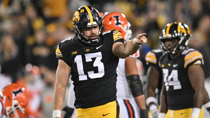 Nov 18, 2023; Iowa City, Iowa, USA; Iowa Hawkeyes defensive end Joe Evans (13) gestures during the fourth quarter against the Illinois Fighting Illini at Kinnick Stadium. Mandatory Credit: Jeffrey Becker-USA TODAY Sports