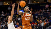 Mar 12, 2025; Nashville, TN, USA;  Texas Longhorns guard Tre Johnson (20) lays the ball in against the Vanderbilt Commodores during the second half at Bridgestone Arena. Mandatory Credit: Steve Roberts-Imagn Images