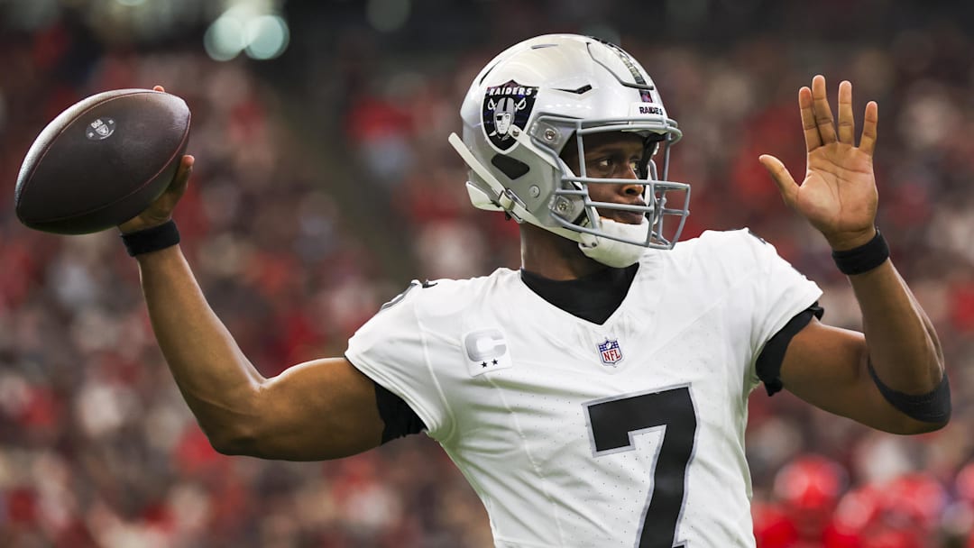 Dec 21, 2025; Houston, Texas, USA; Las Vegas Raiders quarterback Geno Smith (7) passes against the Houston Texans during the first quarter at NRG Stadium. Mandatory Credit: Thomas Shea-Imagn Images