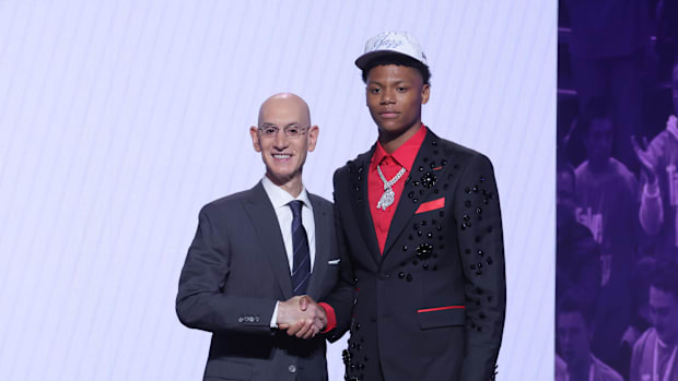 Ace Bailey stands with NBA commissioner Adam Silver after being selected as the fifth pick by the Utah Jazz