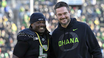 Oregon Ducks running back Noah Whittington poses for a photo with head coach Dan Lanning before the game against the Southern California Trojans at Autzen Stadium.