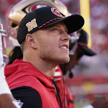 Sep 9, 2024; Santa Clara, California, USA; San Francisco 49ers running back Christian McCaffrey (23) watches from the sideline due to injury during the second quarter against the New York Jets at Levi's Stadium. Mandatory Credit: David Gonzales-Imagn Images