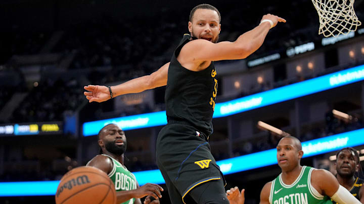 Golden State Warriors guard Stephen Curry has the ball knocked out of his hands against the Boston Celtics.