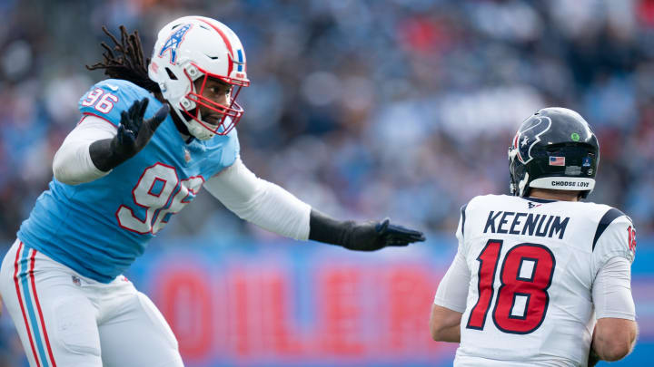 Tennessee Titans defensive end Denico Autry (96) nears a sack against Houston Texans quarterback Case Keenum (18) during their game at Nissan Stadium in Nashville, Tenn., Sunday, Dec. 17, 2023.