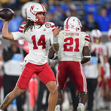 Nov 8, 2025; Pasadena, California, USA; Nebraska Cornhuskers quarterback TJ Lateef (14) throws against the UCLA Bruins during the first half at the Rose Bowl. 