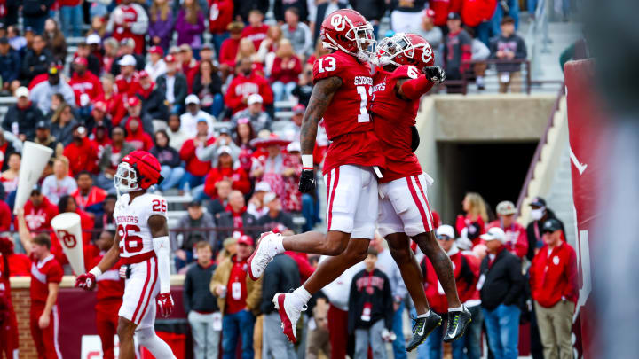 Apr 20, 2024; Norman, OK, USA; Oklahoma Sooners wide receiver Deion Burks (6) celebrates with Oklahoma Sooners wide receiver J.J. Hester (13) after catching a touchdown pass during the Oklahoma Sooners spring game at Gaylord Family OK Memorial Stadium. Mandatory Credit: Kevin Jairaj-USA TODAY Sports