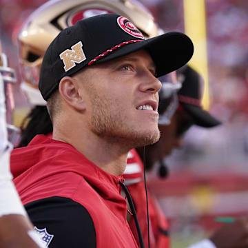 Sep 9, 2024; Santa Clara, California, USA; San Francisco 49ers running back Christian McCaffrey (23) watches from the sideline due to injury during the second quarter against the New York Jets at Levi's Stadium. Mandatory Credit: David Gonzales-Imagn Images