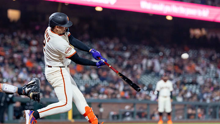 Apr 6, 2026; San Francisco, California, USA; San Francisco Giants shortstop Willy Adames (2) doubles during the ninth inning against the Philadelphia Phillies at Oracle Park. Mandatory Credit: Bob Kupbens-Imagn Images