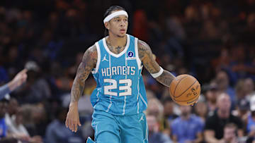 Oct 9, 2025; Oklahoma City, Oklahoma, USA; Charlotte Hornets guard Tre Mann (23) dribbles down the court during a play in the second half of a game between the Charlotte Hornets and the Oklahoma City Thunder at Paycom Center. Mandatory Credit: Alonzo Adams-Imagn Images