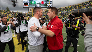 Oregon head coach Dan Lanning, left, shakes hands with Indiana head coach Curt Cignetti as the Oregon Ducks host the Indiana Hoosiers Oct. 11, 2025, at Autzen Stadium in Eugene, Oregon.