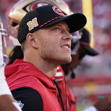 Sep 9, 2024; Santa Clara, California, USA; San Francisco 49ers running back Christian McCaffrey (23) watches from the sideline due to injury during the second quarter against the New York Jets at Levi's Stadium. Mandatory Credit: David Gonzales-Imagn Images