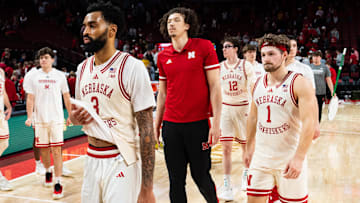 Nebraska's Brice Williams (3), Sam Hoiberg (1), Braxton Meah (red polo) and Gavin Griffiths (12) walk off the court after the Huskers' loss Sunday to Iowa.
