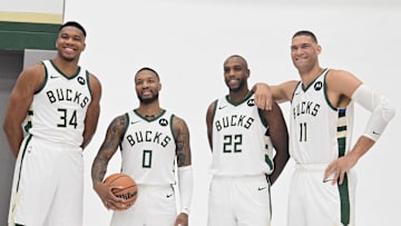 Oct 2, 2023; Milwaukee, WI, USA; Milwaukee Bucks forward Giannis Antetokounmpo (34), guard Damian Lillard (0), forward Khris Middleton (22), and center Brook Lopez (11) pose for a picture during media day in Milwaukee.  Mandatory Credit: Benny Sieu-Imagn Images