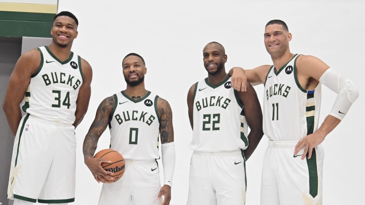 Oct 2, 2023; Milwaukee, WI, USA; Milwaukee Bucks forward Giannis Antetokounmpo (34), guard Damian Lillard (0), forward Khris Middleton (22), and center Brook Lopez (11) pose for a picture during media day in Milwaukee.  Mandatory Credit: Benny Sieu-USA TODAY Sports