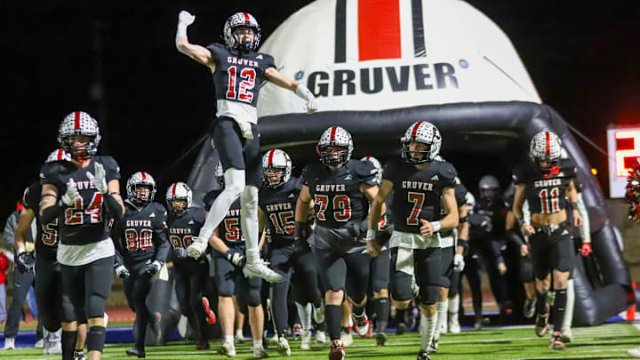 The Gruver football team heads out of the tunnel to face Muenster in a Class 2A Division II state semifinal game Thursday, Dec. 12, 2024 at Fair Park Stadium in Childress, Texas.